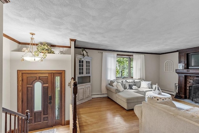 living room featuring a brick fireplace, a baseboard radiator, light hardwood / wood-style flooring, and crown molding