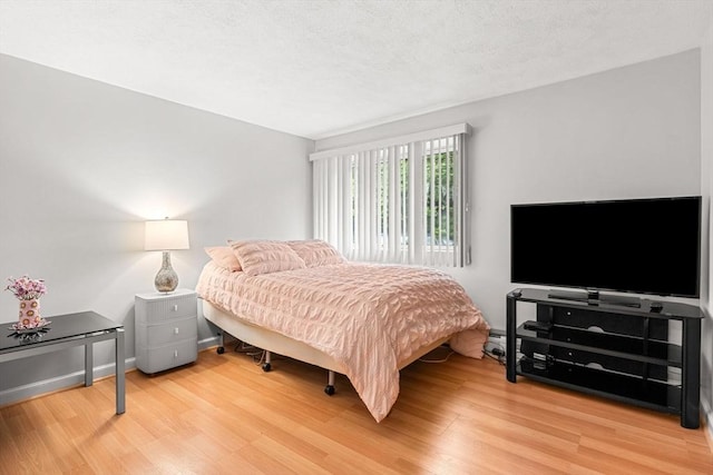 bedroom featuring wood finished floors