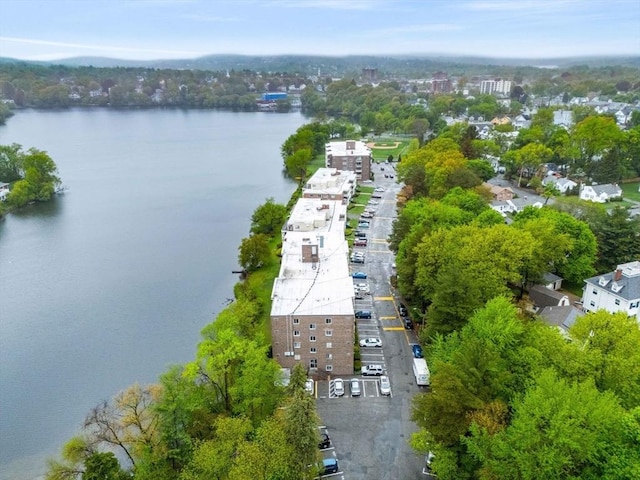 aerial view of property and surrounding area with a nearby body of water