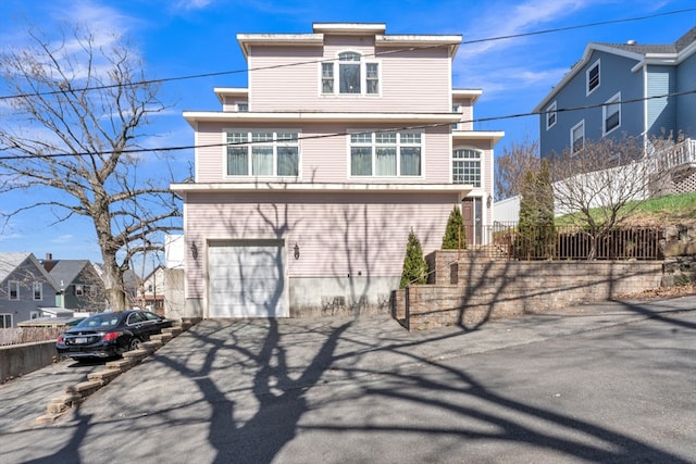 14 Pleasant View Ave, Lynn, MA 01902 - view of front of property with asphalt driveway, a garage, and a residential view
