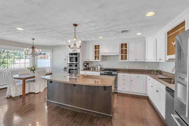 14 Pleasant View Ave, Lynn, MA 01902 - kitchen featuring stainless steel appliances, a chandelier, custom range hood, white cabinets, and recessed lighting