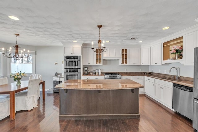 14 Pleasant View Ave, Lynn, MA 01902 - kitchen with a chandelier, appliances with stainless steel finishes, white cabinets, light stone counters, and recessed lighting