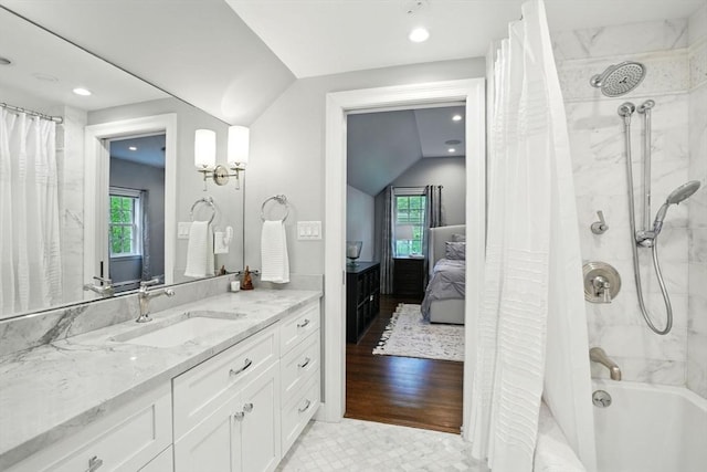 12 Olde Lyme Rd, Winchester, MA 01890 - full bathroom with shower / bath combo with shower curtain, vaulted ceiling, vanity, recessed lighting, and ensuite bath