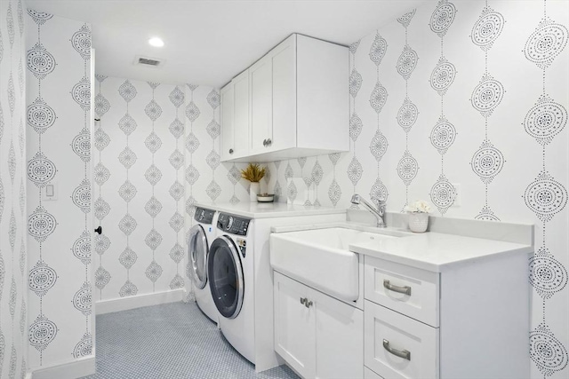 12 Olde Lyme Rd, Winchester, MA 01890 - washroom featuring washer and dryer, wallpapered walls, cabinet space, recessed lighting, and baseboards
