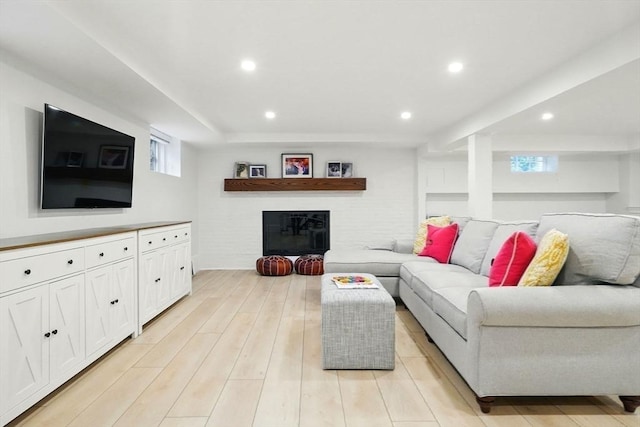 12 Olde Lyme Rd, Winchester, MA 01890 - living room with recessed lighting, a glass covered fireplace, and light wood-type flooring