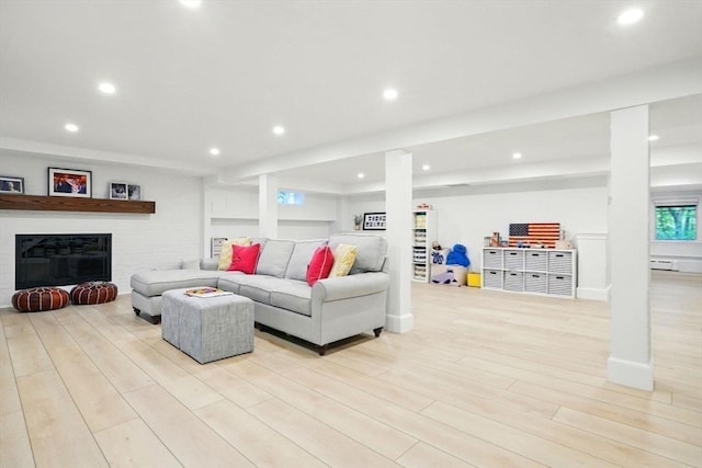 12 Olde Lyme Rd, Winchester, MA 01890 - living area featuring recessed lighting, light wood-style flooring, a glass covered fireplace, and baseboards