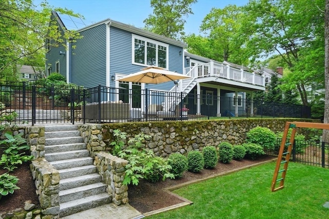 12 Olde Lyme Rd, Winchester, MA 01890 - back of property featuring stairs and a wooden deck