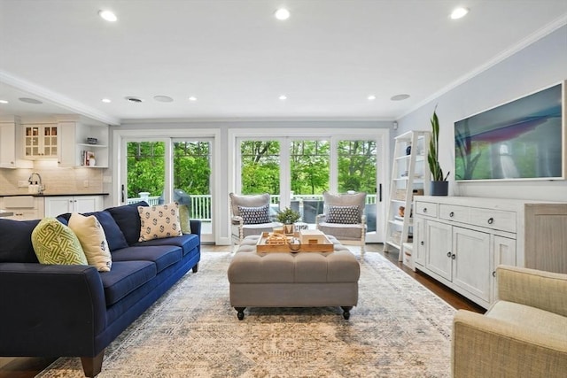 12 Olde Lyme Rd, Winchester, MA 01890 - living room with ornamental molding, recessed lighting, and light wood-type flooring