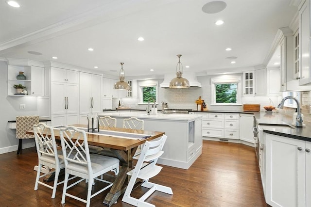 12 Olde Lyme Rd, Winchester, MA 01890 - dining area featuring plenty of natural light, dark wood finished floors, recessed lighting, and crown molding