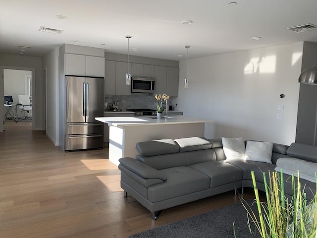 16 Boardman St Unit 204A, Boston, MA 02128 - living room with light wood finished floors and recessed lighting