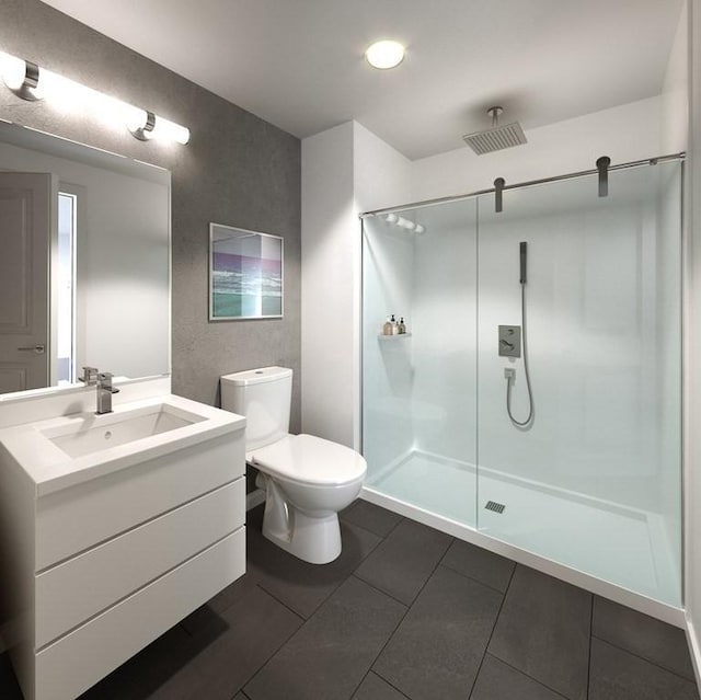 16 Boardman St Unit 204A, Boston, MA 02128 - bathroom featuring a shower stall, toilet, vanity, and tile patterned flooring
