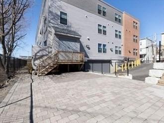 16 Boardman St Unit 204A, Boston, MA 02128 - view of property with fence and stairs
