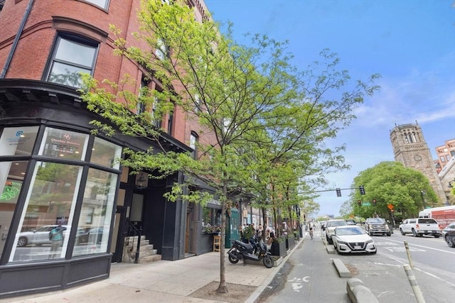 31 Massachusetts Ave Unit 4-4, Boston, MA 02115 - view of asphalt street featuring traffic lights, sidewalks, curbs, and street lighting