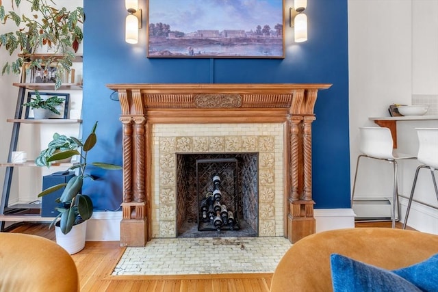 31 Massachusetts Ave Unit 4-4, Boston, MA 02115 - detailed view of wood finished floors, a tiled fireplace, and baseboard heating