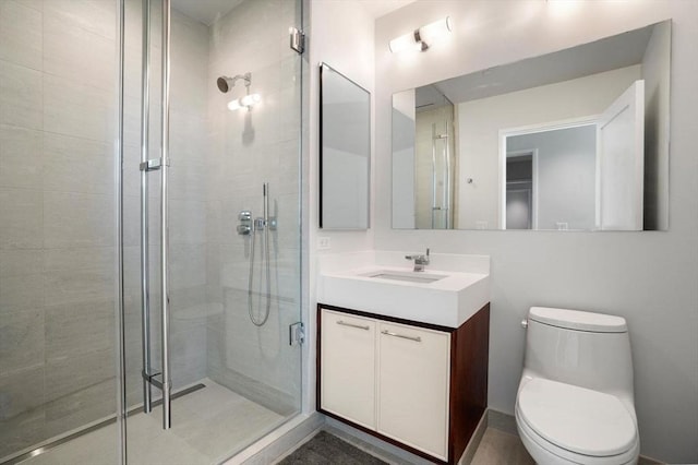 bathroom with vanity, toilet, and walk in shower