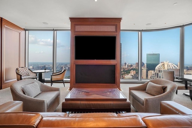 living room featuring a wall of windows