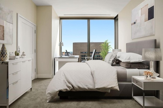 bedroom featuring light colored carpet and a wall of windows