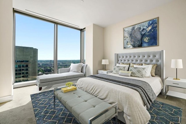 carpeted bedroom with a wall of windows