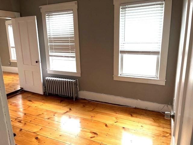 129 3rd St, Lowell, MA 01850 - empty room with radiator and plenty of natural light