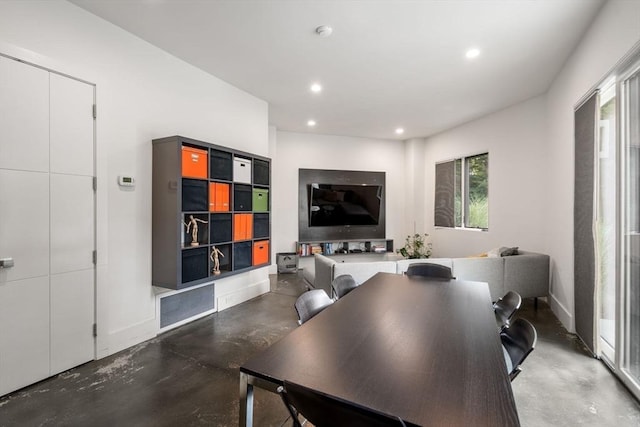 dining space with visible vents, recessed lighting, finished concrete flooring, and baseboards