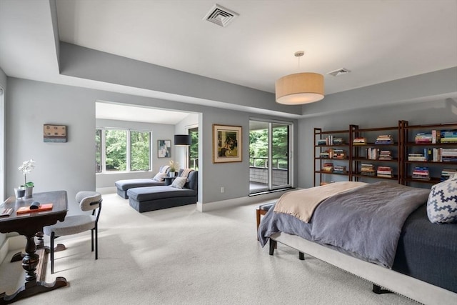 carpeted bedroom with visible vents and baseboards