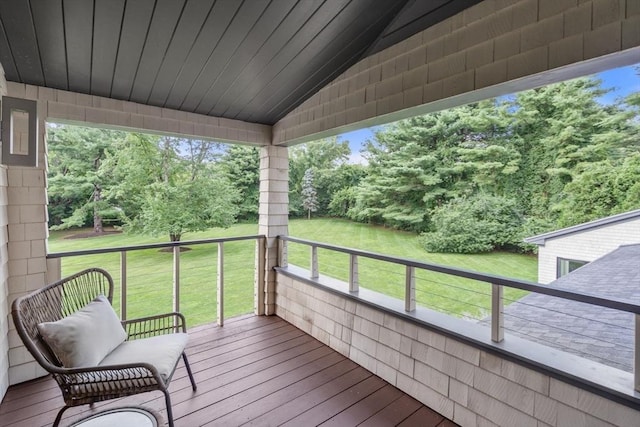 wooden deck with a yard