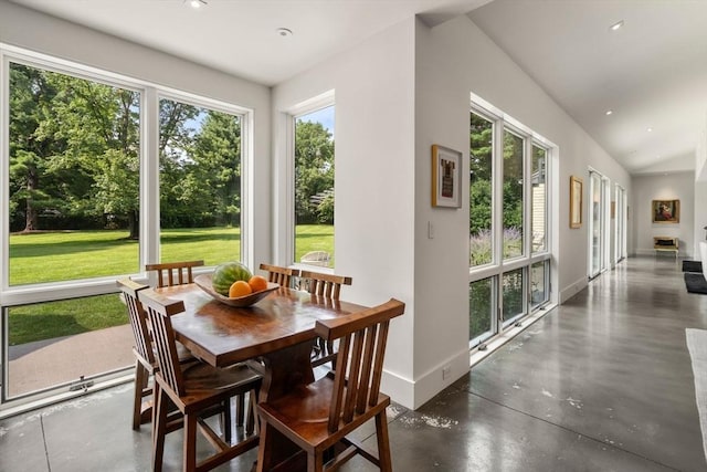 sunroom / solarium featuring vaulted ceiling