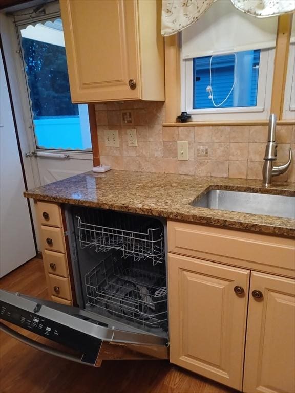822 N Eastern Ave, Fall River, MA 02720 - kitchen with a sink, wood finished floors, stone countertops, and backsplash