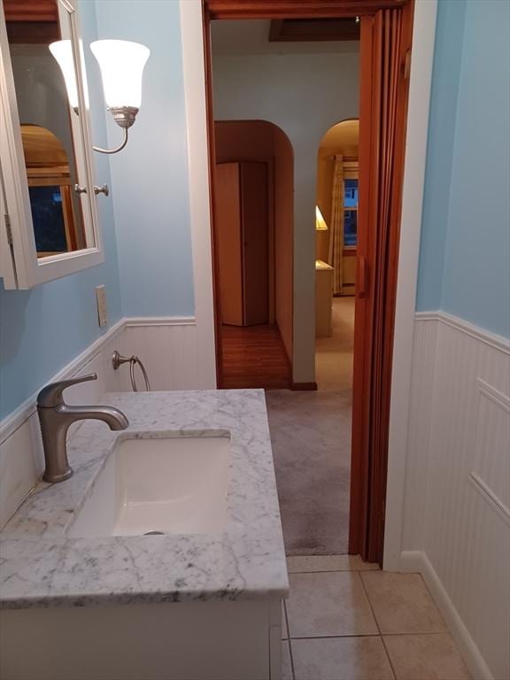 822 N Eastern Ave, Fall River, MA 02720 - bathroom featuring a wainscoted wall, vanity, and tile patterned flooring