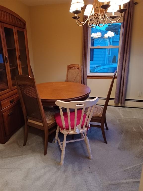 822 N Eastern Ave, Fall River, MA 02720 - dining room featuring a chandelier, light colored carpet, and baseboard heating
