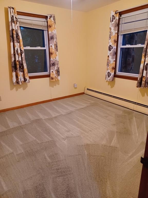 822 N Eastern Ave, Fall River, MA 02720 - unfurnished room featuring carpet flooring, baseboards, and baseboard heating