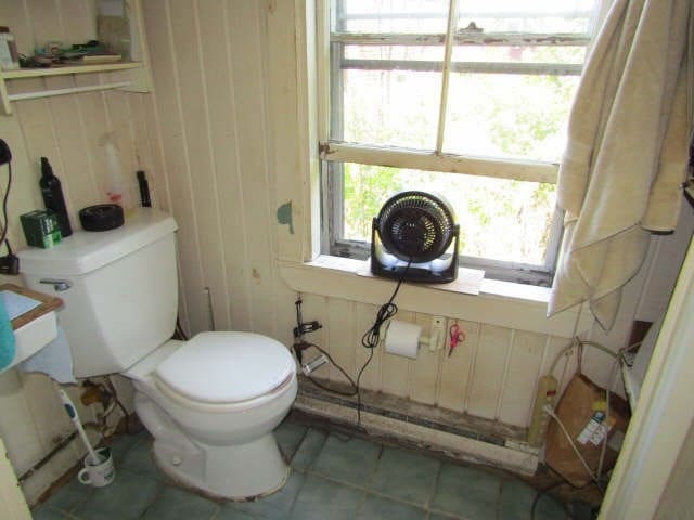 bathroom with tile patterned flooring and toilet