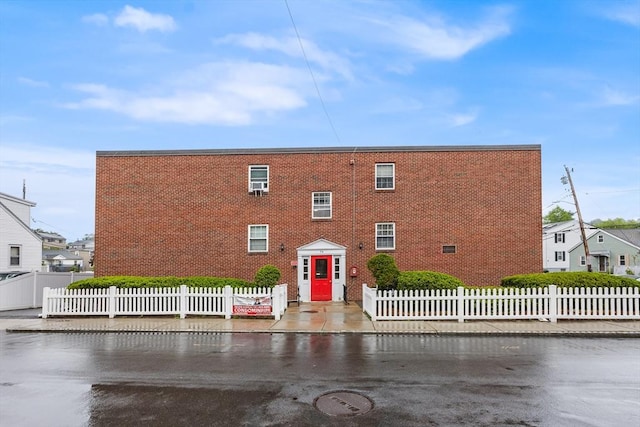 74 Springvale Ave Unit 7, Chelsea, MA 02150 - view of building exterior with a fenced front yard