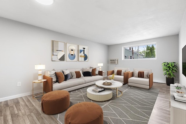 74 Springvale Ave Unit 7, Chelsea, MA 02150 - living room featuring wood finished floors, a wall mounted AC, and baseboards