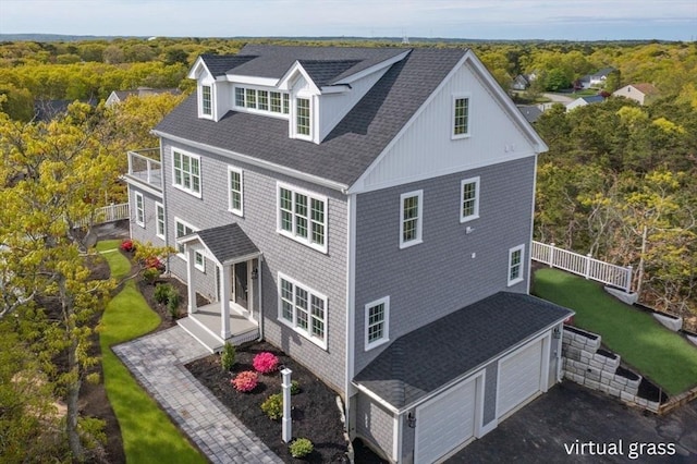29 Sheppard Rd, Bourne, MA 02562 - rear view of property with a balcony, a wooded view, and roof with shingles