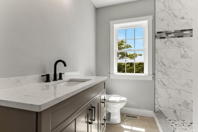 29 Sheppard Rd, Bourne, MA 02562 - full bath featuring baseboards, toilet, vanity, a tile shower, and marble look tiles