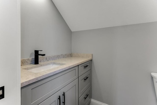 29 Sheppard Rd, Bourne, MA 02562 - bathroom with vanity, lofted ceiling, and toilet