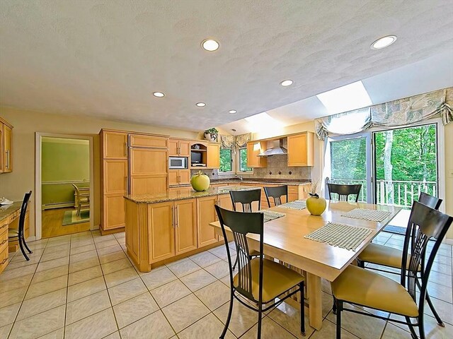 46 Clear Pond Rd, Falmouth, MA 02540 - dining area with light tile patterned flooring and recessed lighting