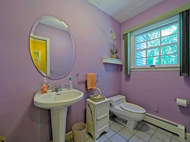46 Clear Pond Rd, Falmouth, MA 02540 - half bathroom with baseboard heating and tile patterned floors