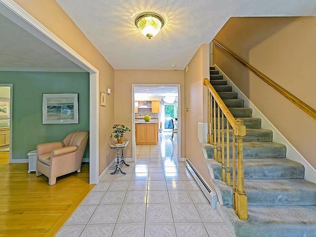 46 Clear Pond Rd, Falmouth, MA 02540 - entrance foyer with baseboard heating and stairway