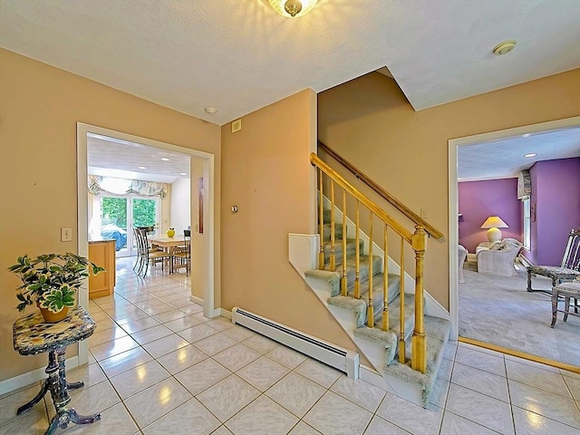 46 Clear Pond Rd, Falmouth, MA 02540 - stairway featuring baseboard heating, tile patterned flooring, and recessed lighting