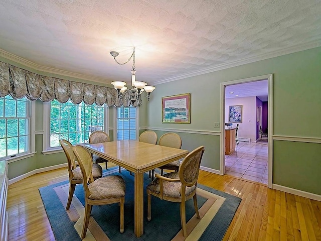 46 Clear Pond Rd, Falmouth, MA 02540 - dining space featuring a chandelier, crown molding, and light wood-style floors