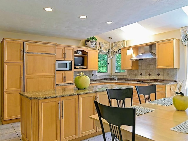 46 Clear Pond Rd, Falmouth, MA 02540 - kitchen with wall chimney range hood, stainless steel microwave, vaulted ceiling, backsplash, and recessed lighting