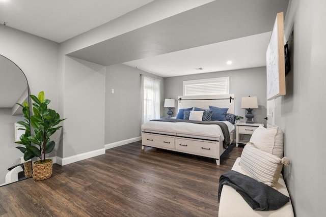 bedroom featuring wood finished floors, baseboards, and recessed lighting