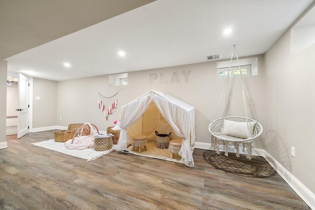 rec room featuring wood finished floors, baseboards, and recessed lighting
