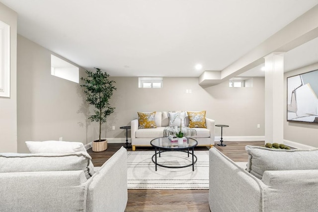 living area featuring wood finished floors, baseboards, and recessed lighting