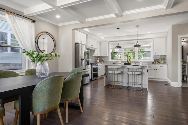 dining area featuring beamed ceiling, recessed lighting, dark wood-style floors, ornamental molding, and coffered ceiling