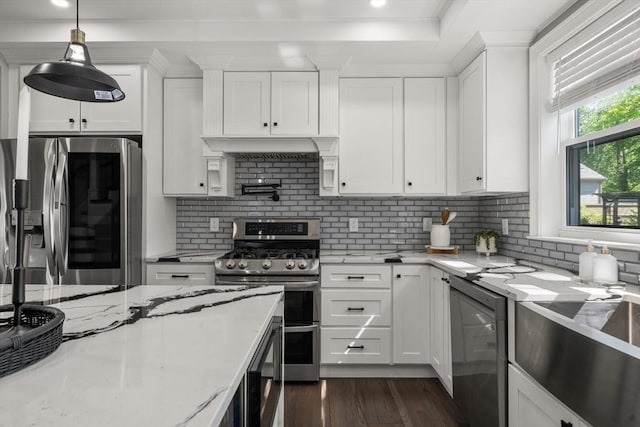 kitchen with stainless steel appliances, white cabinetry, dark wood-style flooring, decorative backsplash, and recessed lighting