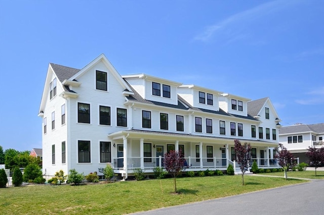 6 Macdonald Ter Unit E, Scituate, MA 02066 - view of property featuring a porch and a front yard