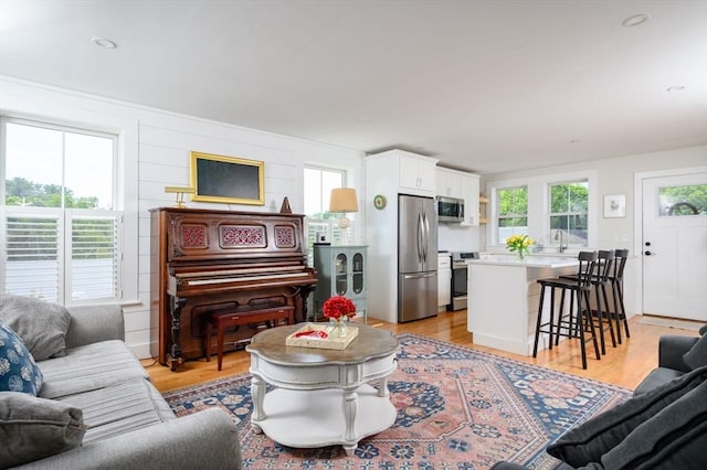 6 Macdonald Ter Unit E, Scituate, MA 02066 - living area featuring healthy amount of natural light and light wood-style floors